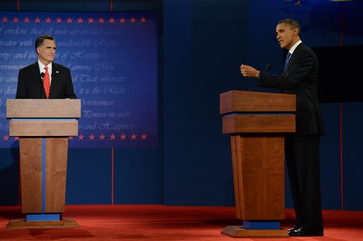 Former Massachusetts Governor Mitt Romney, left, listens as President Barack Obama speaks during their first presidential debate at the University of Denver Wednesday, Oct. 3, 2012 in Denver. (AP Photo/The Denver Post, John Leyba) MAGS OUT; TV OUT; INTERNET OUT