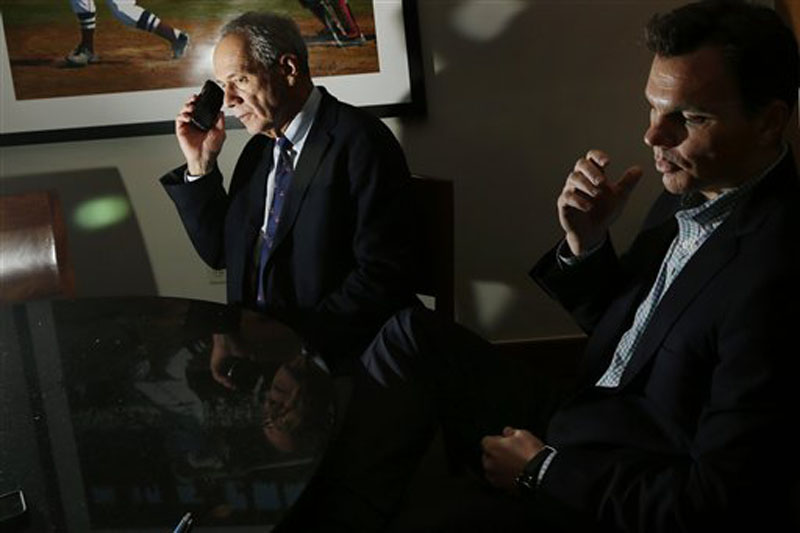 Boston Red Sox President and CEO Larry Lucchino. left, and general manager Ben Cherington appear during an interview at Fenway Park in Boston, Thursday, Oct. 4, 2012, hours after announcing that manager Bobby Valentine will not return in 2013. The Red Sox finished their baseball season in last place for the first time in 20 years. (AP Photo/Elise Amendola)