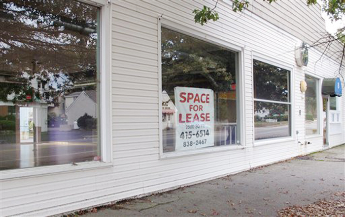 A for lease sign hangs in the window of the former Pura Vida fitness studio in Kennebunk recently. Alexis Wright has been charged with running a prostitution operation out of the studio and a nearby one-room office.