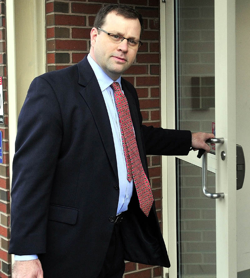 Attorney John Martin enters Skowhegan District Court for a hearing for his client Kelli Murphy, 11, on Monday.