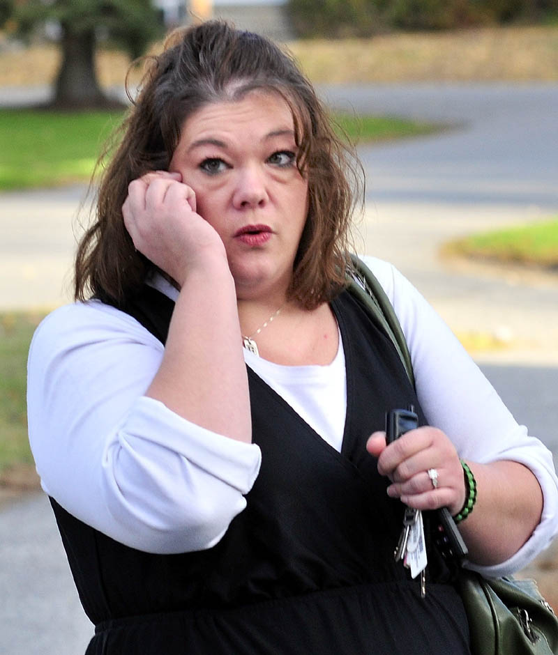 Nicole Greenaway of Clinton speaks on a cellphone before entering the Skowhegan District Court on Monday for a hearing for defendant Kelli Murphy, accused in the death of Greenaway's infant daughter Brooklyn Foss-Greenaway.