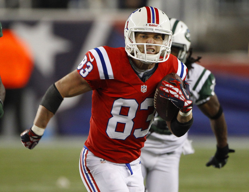 Wes Welker turns upfield after a third-quarter reception from Tom Brady, who completed 26 of 42 passes.