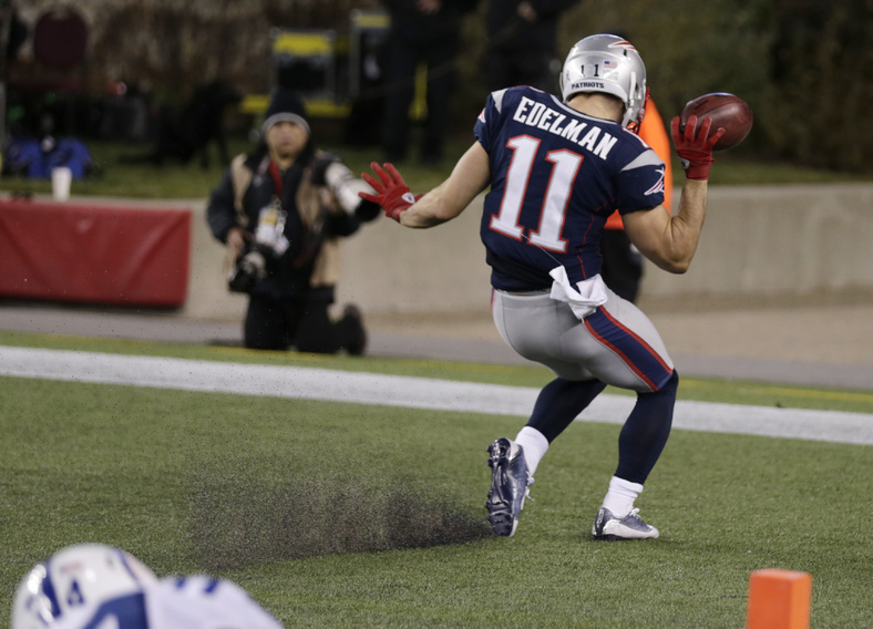 New England Patriots wide receiver Julian Edelman celebrates his touchdown against the Indianapolis Colts in the second quarter Sunday at Gillette Stadium in Foxborough, Mass. Gillette Stadium