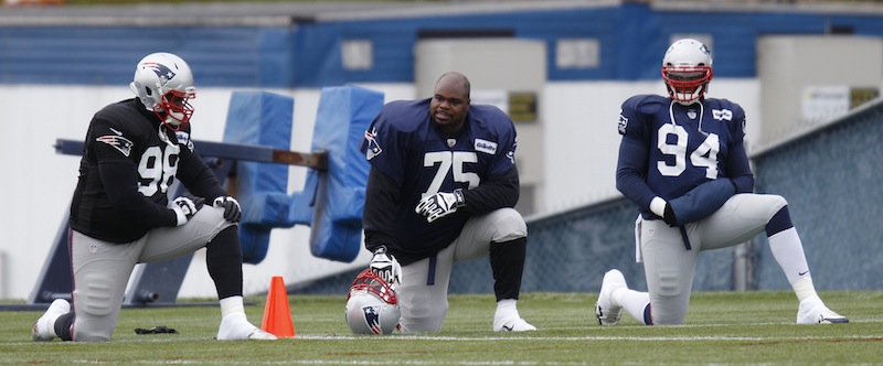 New England Patriots defensive tackle Vince Wilfork (75) talks with defensive lineman Marcus Forston (98) and defensive end Justin Francis (94) during NFL football practice at the team's training facility in Foxborough, Mass., Wednesday, Nov. 28, 2012. (AP Photo/Stephan Savoia) Gillette Stadium