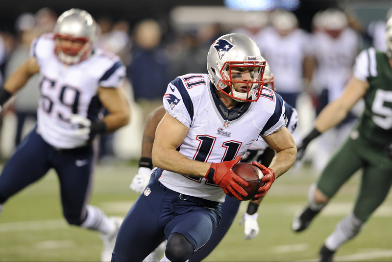 Julian Edelman returns a Jets fumble for a Patriots touchdown during the first half Thursday night in East Rutherford, N.J. NFLACTION12;