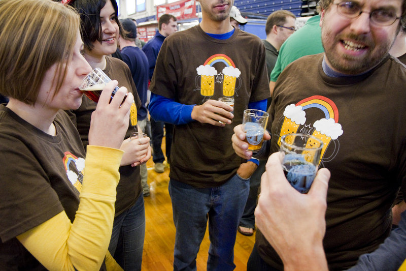 Wesley Littlefield of Pittston, right, shares a thought while sampling local brews with Alyssa Littlefield of West Gardiner, left, and Kaitlynn Littlefield of Pittston.