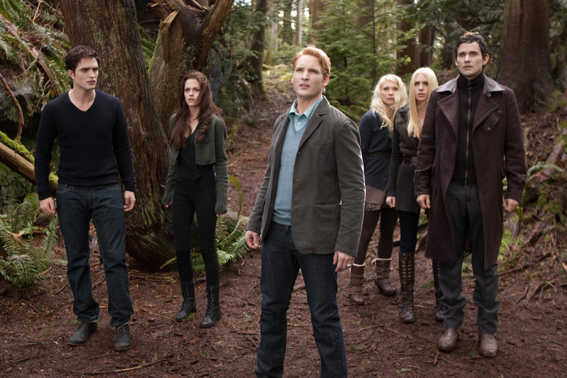 From left, Robert Pattinson, Kristen Stewart, Peter Facinelli, MyAnna Buring, Casey LaBow and Christian Camargo in a scene from “The Twilight Saga: Breaking Dawn – Part 2.”