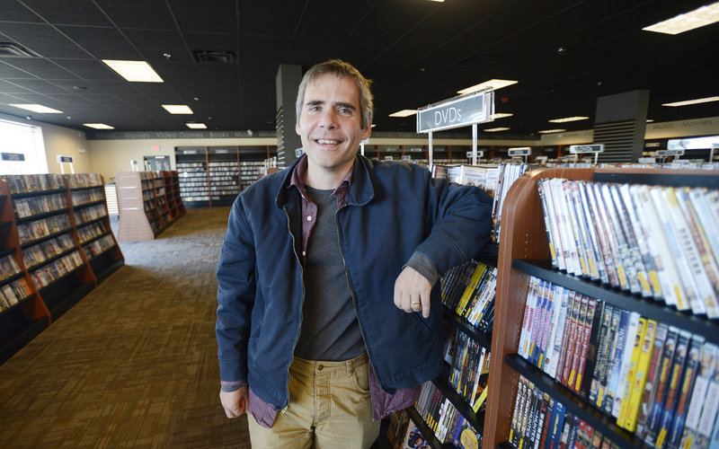 Bull Moose’s Brett Wickard spends time in his new Mill Creek store.