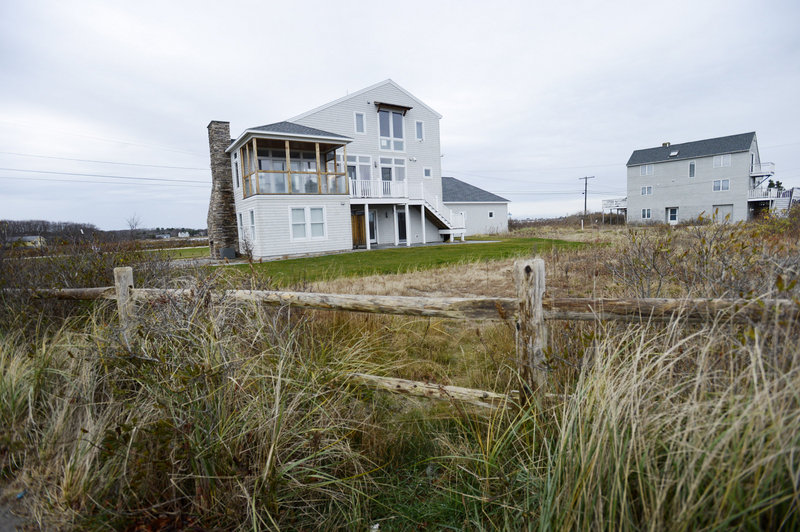 Cathleen and Bob Joyce’s new home is a contemporary that faces the ocean on one side and “the pool” on the other.