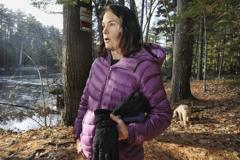 Sara Lennon of Cape Elizabeth walks the property off Shore Road known as Robinson Woods II. She said the town’s $350,000 contribution shows the high priority residents place on open land.