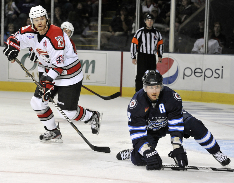 Now healthy after missing most of last season with a shoulder injury, Alexandre Bolduc, left, is among the AHL’s scoring leaders.
