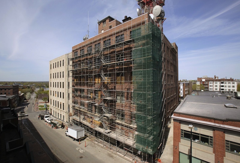 In this 2011 file photo, the central office building for FairPoint Communications at the corner of Cumberland Avenue and Forest Avenue in Portland undergoes a multimillion-dollar renovation. FairPoint Communications, which provides telephone and Internet services, said on Friday it laid off 29 workers, mostly in Maine and New Hampshire.