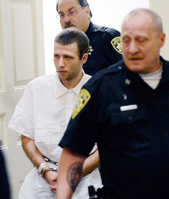 Derek Poulin, who is charged with arson and murdering his grandmother Patricia Noel, is ledinto York County Superior Court in Alfred Tuesday, October 30, 2012.