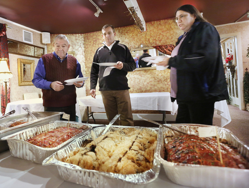 Judges Stillman Bradish, left, Ogunquit's Citizen of the Year; Bill Slattery, a sous chef at York Harbor Inn; and Ogunquit police chief Patricia Arnaudin taste meatloaf dishes at Bintliff's Restaurant in Ogunquit on Sunday. The meatloaf contest is part of a dinner fundraiser for Marginal Way Preservation Fund.