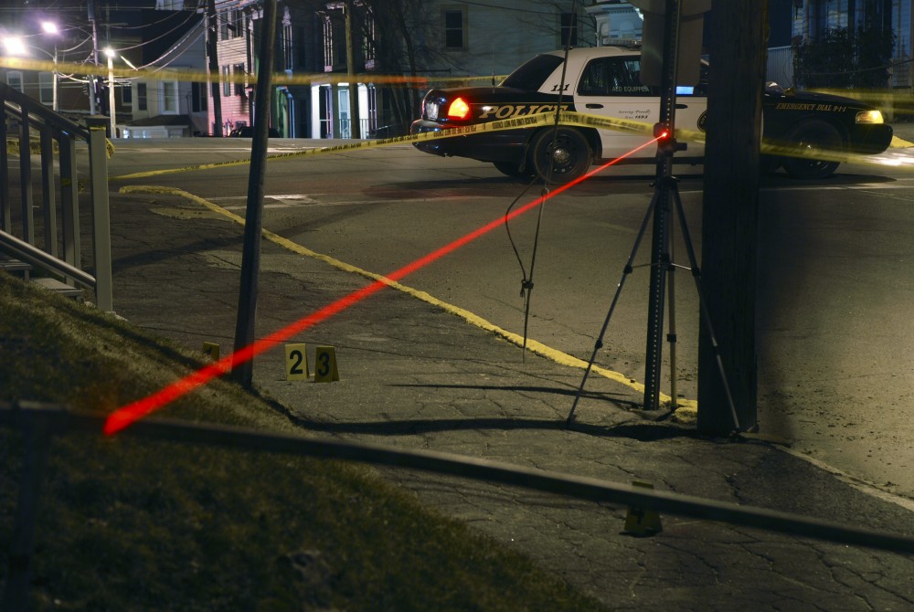 Investigators working with the Maine Attorney General's Office use lasers to map the path of bullets fired in the police shooting of Barbara Stewart of Biddeford on March 24, 2009. Photo is from the AG's investigative case file on the shooting.