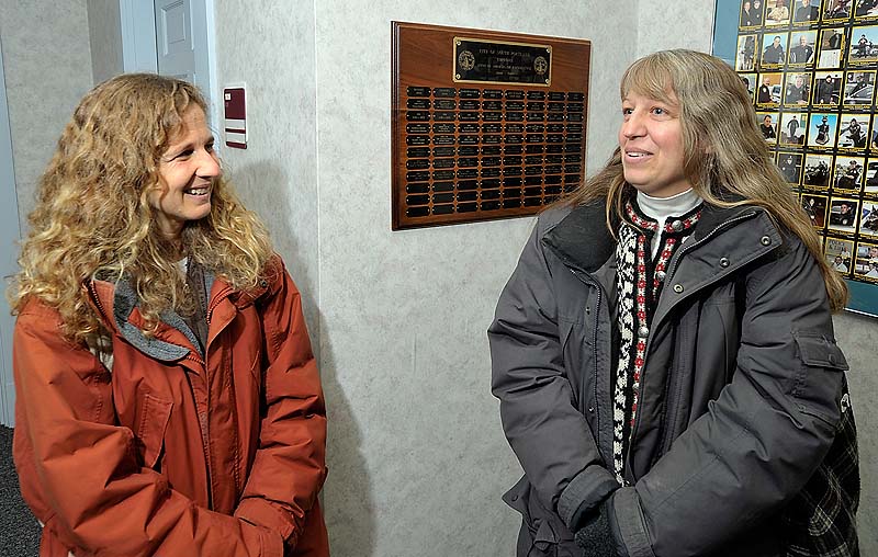 Laura Minervino, left, and Robin Elliott have been committed for the past 23 years and were delighted to get their license as same-sex couples received marriage certificates Saturday at South Portland City Hall. They have a wedding planned at the Victoria Mansion next month.