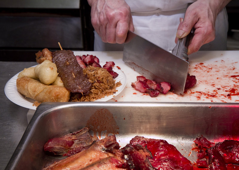 One of the Wok Inn’s most popular items, the No. 15, is prepared at the restaurant.