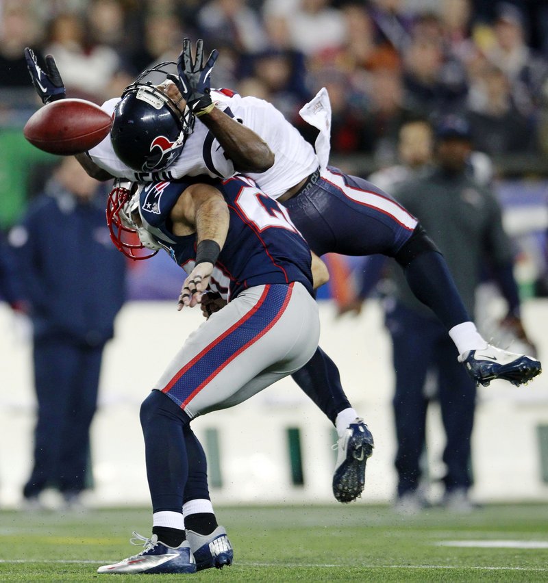 Steve Gregory, a strong safety for the Pats, breaks up a pass for Houston’s Lestar Jean in the second quarter Monday night in Foxborough, Mass.