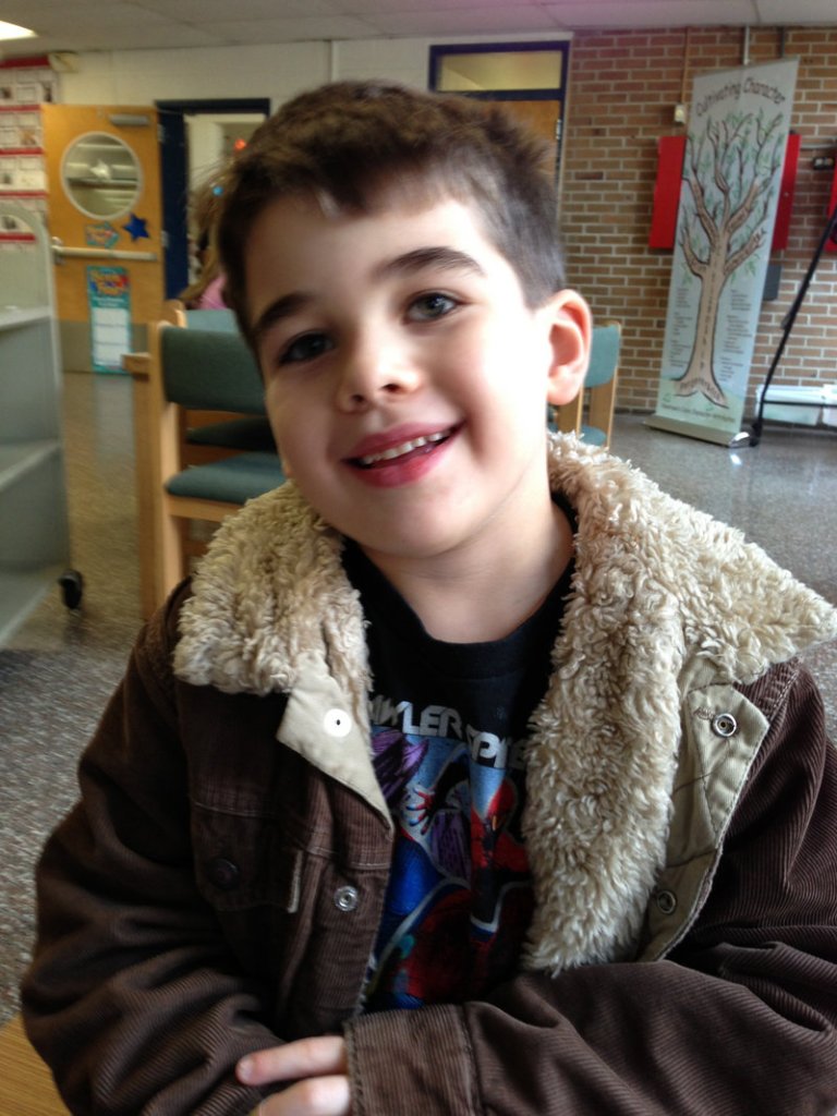 Six-year-old Noah Pozner smiles for the photographer in the Nov. 13 family photo. He was one of the 20 children killed in the Sandy Hook elementary school shooting in Newtown, Conn., on Friday.