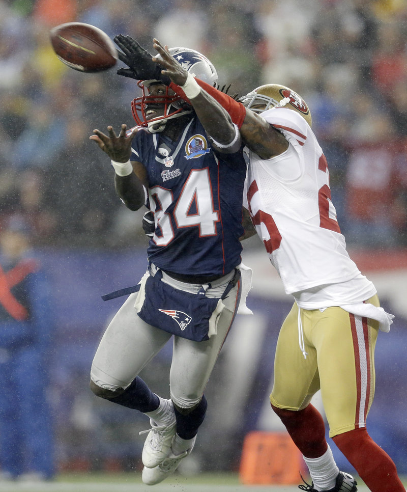 San Francisco cornerback Tarell Brown breaks up a pass in the end zone intended for Deion Branch during the Patriots’ 41-34 loss Sunday night at Gillette Stadium.