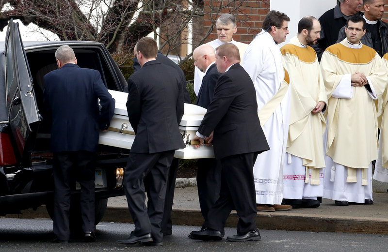 Pallbearers carry a casket out of St. Rose of Lima Roman Catholic Church on Tuesday after funeral services for Jessica Rekos, 6, who was among those killed when Adam Lanza walked into Sandy Hook Elementary School and opened fire.