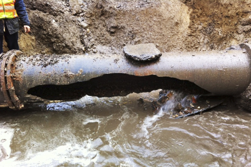 A 20-inch water main break at 128 Somerset St. in Portland's Bayside neighborhood Wednesday, December 19, 2012. Wednesday's rupture of a century-old water main that flooded Somerset Street, disrupted 4,000 homes and businesses and prompted a 24-hour boil-water notice exposed a stark reality: Most of Portland's water pipes are old.