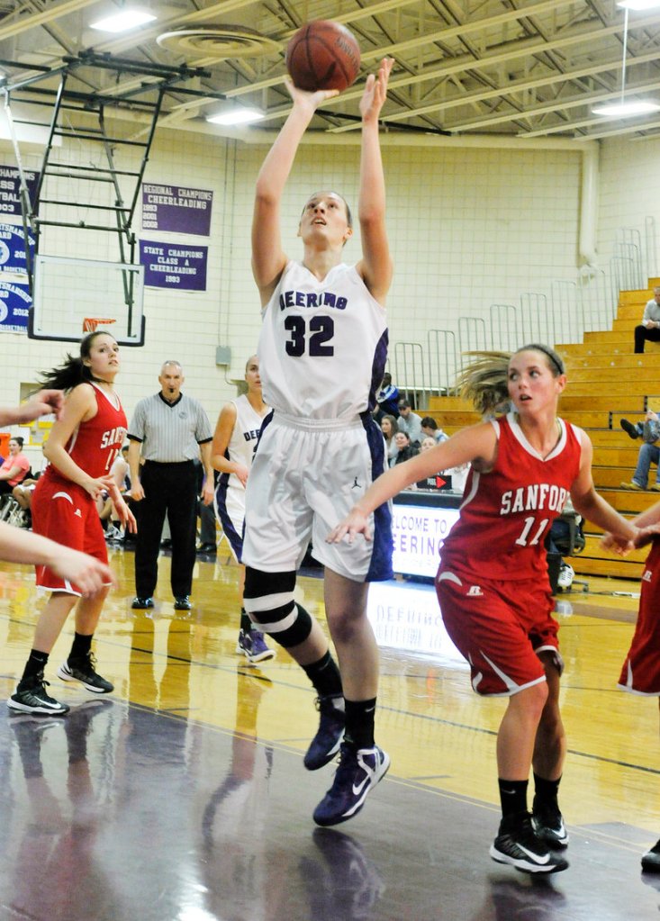 Marissa MacMillan of Deering shoots after grabbing an offensive rebound in the first half. MacMillan keyed a17-4 run in the first half that put the Rams in control.