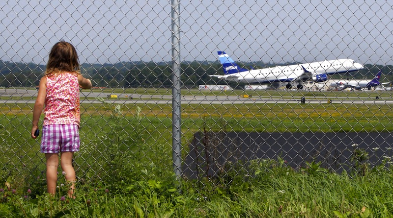 Hannah Jacob, 4, watches a JetBlue plane take off at the Portland International Jetport on Friday, August 19, 2011. Pending final accreditation, the University of Maine at Augusta will begin offering a bachelor’s degree in aviation this fall, the university system announced on Monday, Jan. 28, 2012.