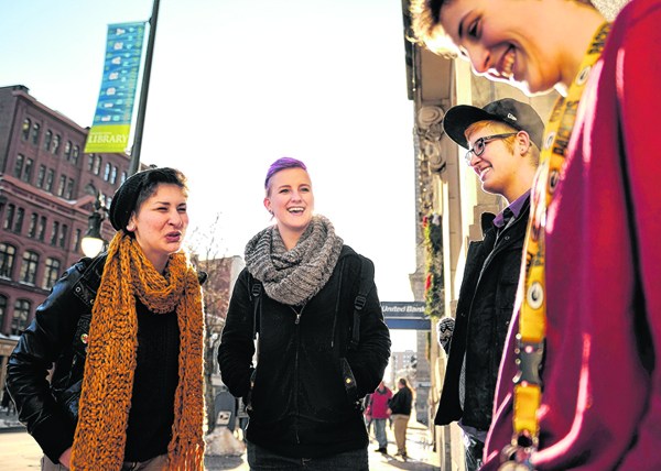 A group of friends, left to right, Elizabeth Sines, River Lenard, Dex Robbins and Logan Cooper, smoke together outside the Portland Public Library on Monday. They say they are against a proposed smoking ban in Monument Square.