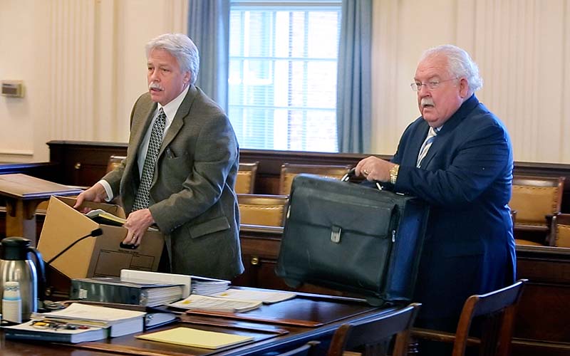 Mark Strong Sr., left, and his attorney Daniel Lilley arrive Wednesday in York County Superior Court in Alfred. Strong has pleaded not guilty to 59 misdemeanors in the case.