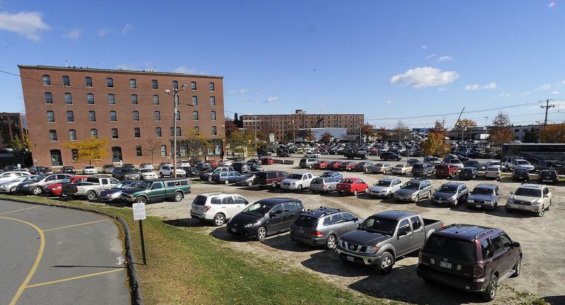 This dirt parking lot at 321 Congress St. currently occupies the site where J.B. Brown and Sons plans a 131-room Courtyard by Marriott with 14 penthouse apartments.