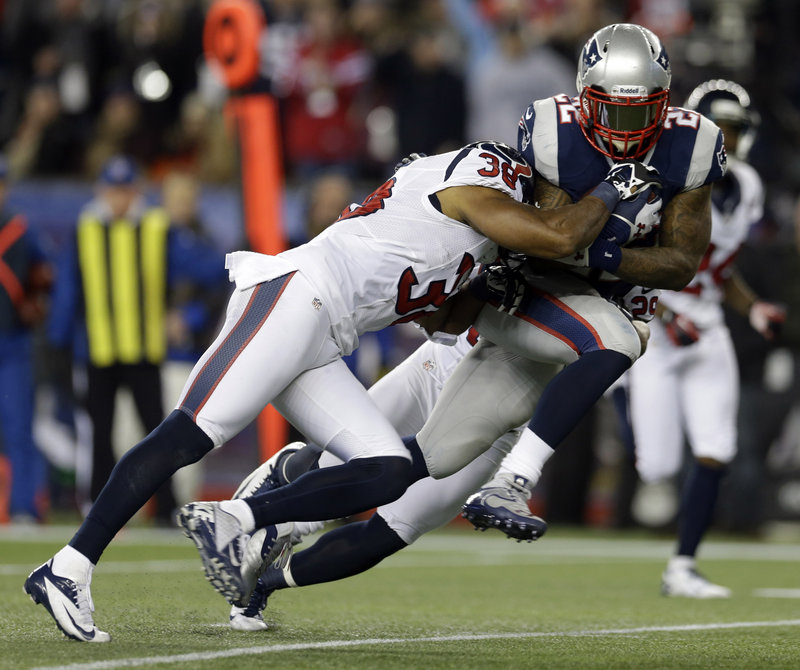 Patriots running back Stevan Ridley drags Texans safety Danieal Manning into the end zone for an 8-yard touchdown run on the opening drive of the second half.