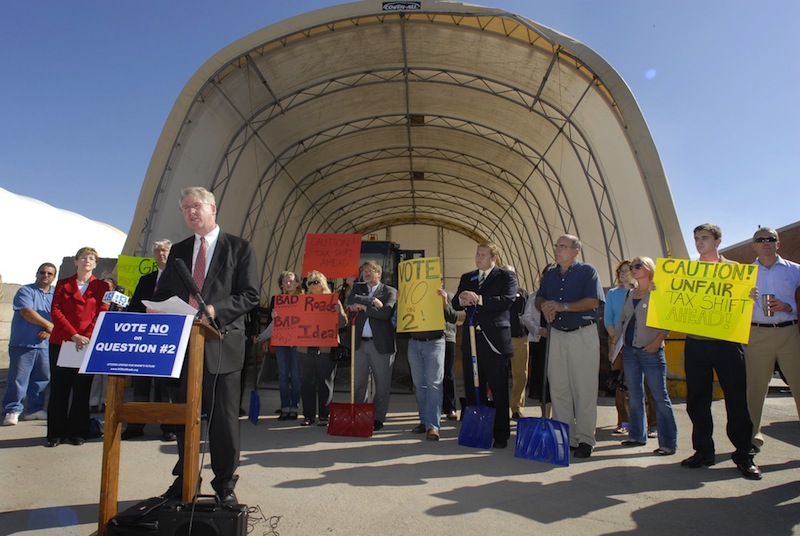 In this 2009 file photo, Christopher Lockwood, executive director of the Maine Municipal Association, speaks in Portland at a rally opposing Question 2, which would cut the automobile excise tax. A U.S. District Court determined Thursday, Feb. 14, 2013 that the MMA was within its rights to campaign against five separate voter-referendum efforts that would have reduced town revenues. The lawsuit was filed by the Maine Heritage Policy Center – a conservative political group.