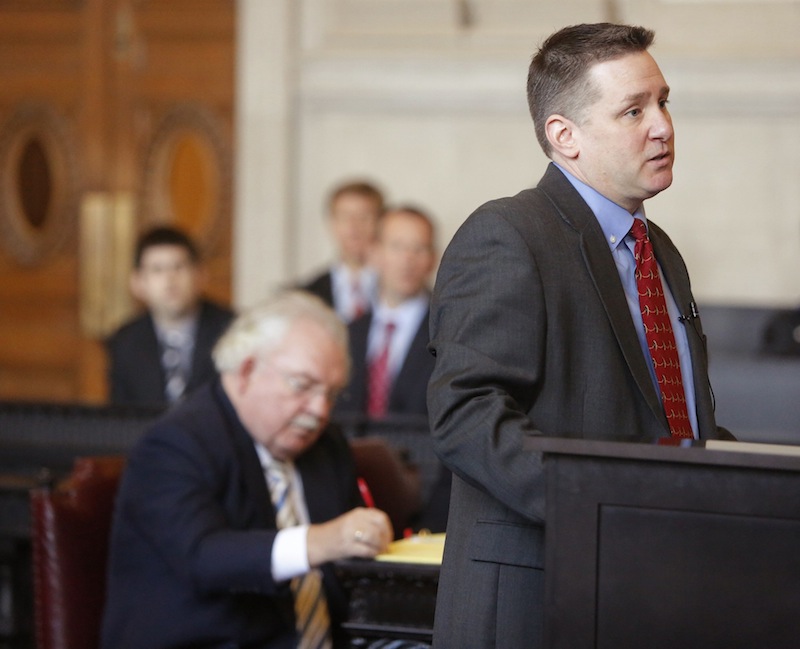 Assistant District Attorney Patrick Gordon addresses questions posed by justices of the Maine Supreme Judicial Court during oral arguments on Wednesday, February 13, 2013. The court heard arguments in the appeal by prosecutors on the dismissal of 46 invasion-of-privacy charges against Mark Strong, Sr. in the Kennebunk prostitution case. Taking notes behind Gordon is Strong's attorney Daniel Lilley.