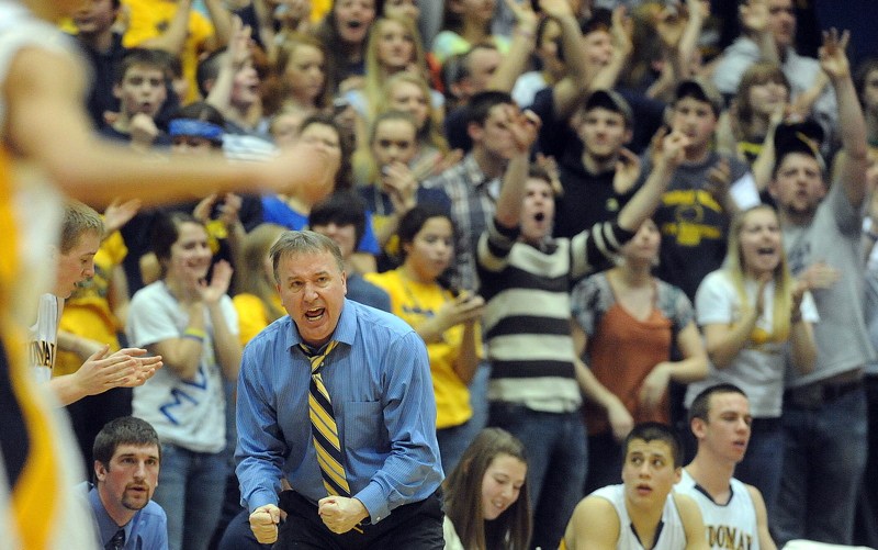 Medomak Valley Coach, Nicholas DePatsy celebrates a 3-point shot against MDI in the Eastern Class B championship game at the Bangor Auditorium Saturday.