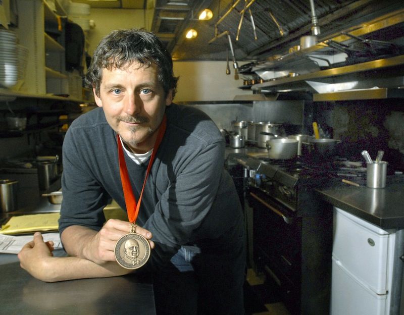 Chef Rob Evans, the owner of Duckfat and former owner of Hugo’s in Portland, holds his 2009 James Beard Foundation best chef award.