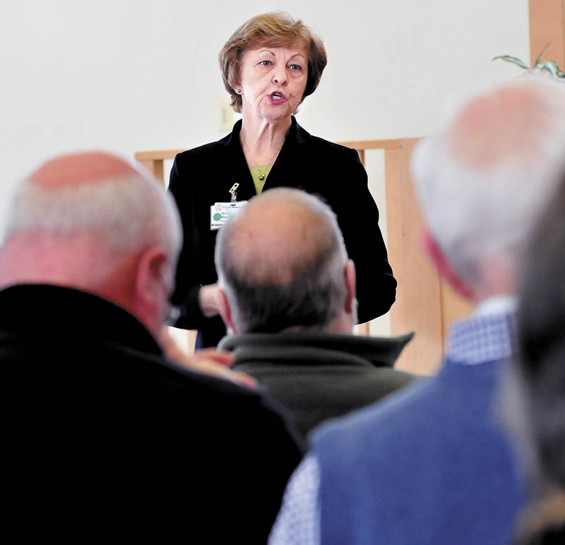 President and CEO of Franklin Memorial Hospital/Franklin Community Health Network, Rebecca Ryder, explains to area community and organization leaders the financial status of the institutions and how to reduce expenses on Wednesday in Farmington.