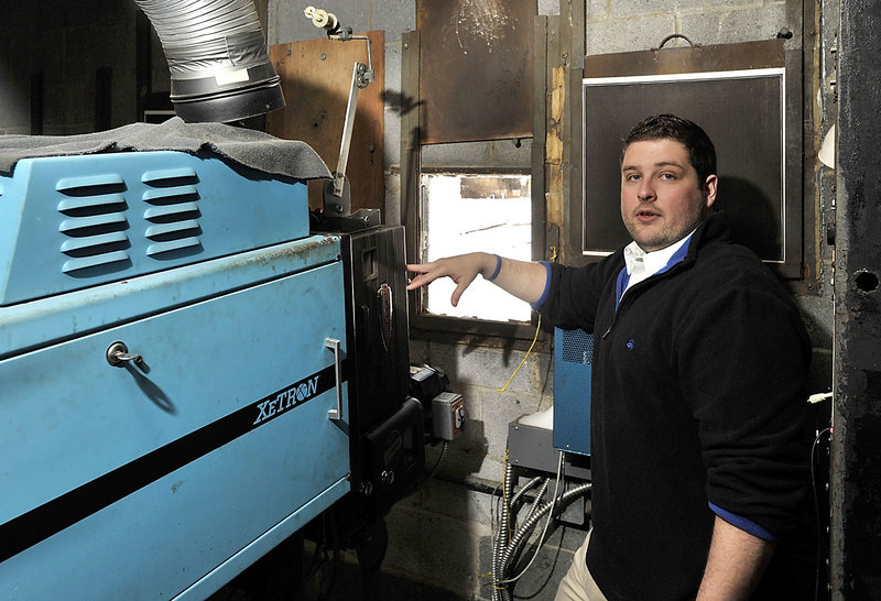 Ry Russell, who runs the Saco Drive-In, says this old film projector that has to be replaced with a digital projector at the cost of about $90,000 if the theater is to survive. Photographed on Wednesday, Feb. 13, 2013.