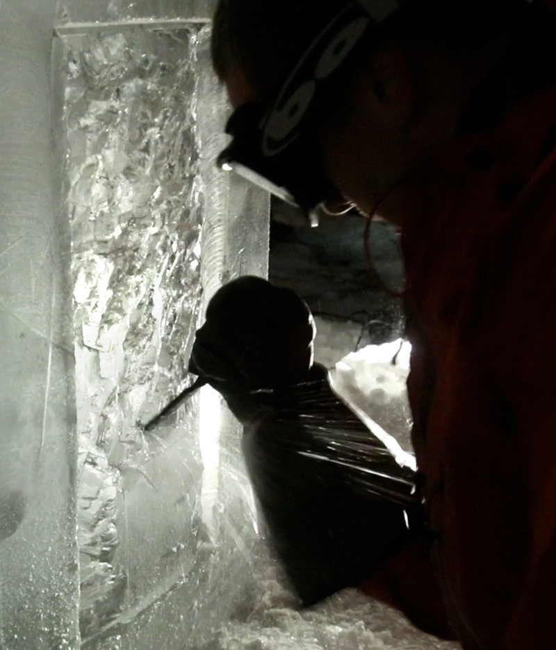 Ice sculptor Jesse Bouchard uses a chisel to chip a detail in a block of ice at his South Portland home on Tuesday, February 12, 2013. The blocks will be constructed into an ice bar at the Hilton Garden Inn in Freeport on Friday night.