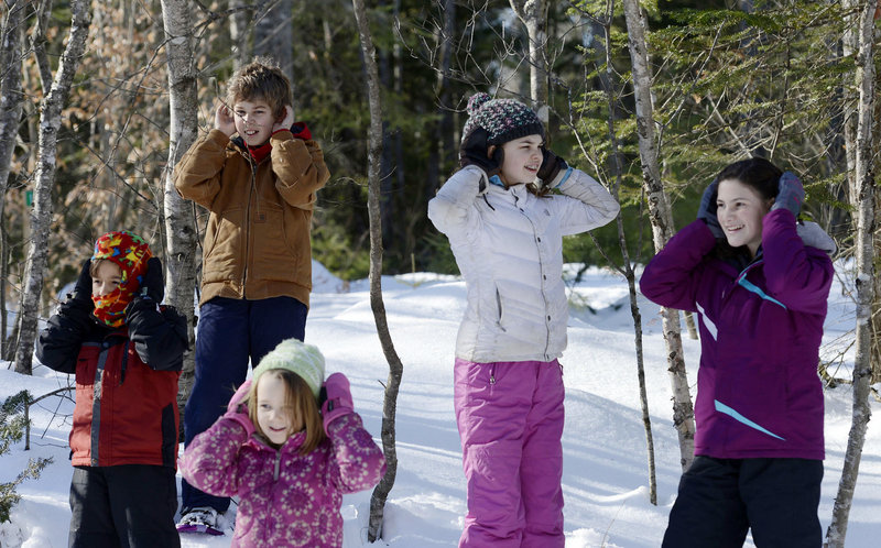 Glenn Powers’ students aren’t hearing no evil; they’re attempting to view a snowy day in the woods from the keen senses of the critters who dwell there.