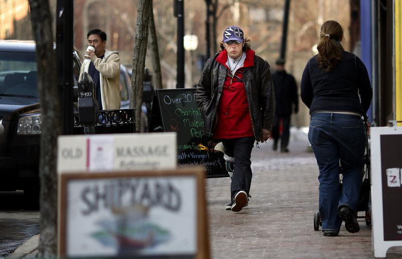 Robert Smith whistles his way down Exchange Street in Portland recently. “I’m just trying to make people smile,” Smith says. But he disturbs some listeners, leading to legal troubles for Smith that he says won’t stop him from expressing himself.