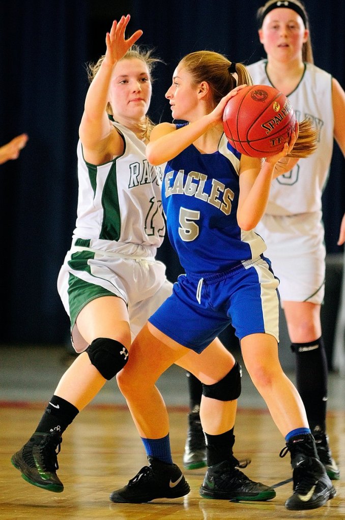 Ellie Snyder of Islesboro keeps the ball from Taylor Esty of Rangeley in Western Class D. Rangeley captured its quarterfinal, 52-28.
