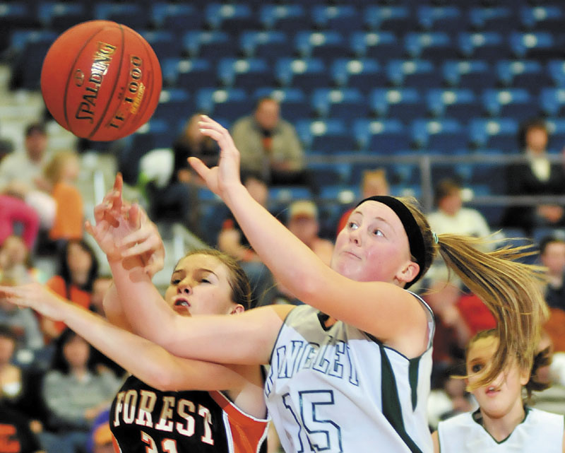 Rangeley's Taylor Esty, right, goes up for a shot against Anna Carrier of Forest Hills in a Western Class D semifinal Thursday at the Augusta Civic Center. Rangeley won, 59-43.