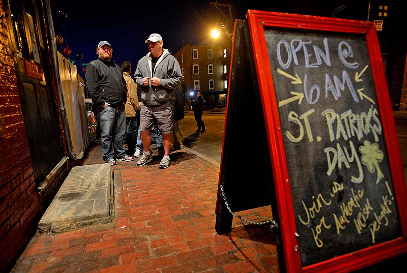 Tim Rines, left, of Portland, and Bruce Ruzzoli of Randolph were the first in line on St. Patrick’s Day at Brian Boru on Sunday. Of Guinness beer, Ruzzoli said, “It goes with everything.”