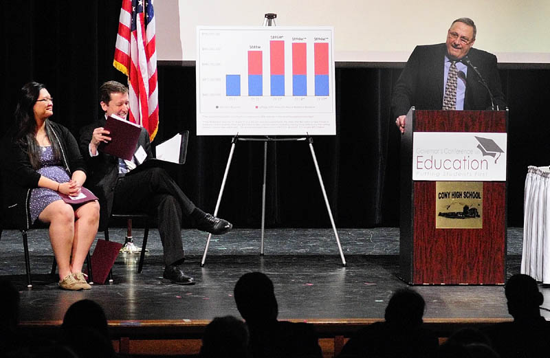 Michelle Zhang, a Cony High School senior, and Stephen Bowen, commissioner of education, listen as Gov. Paul LePage opens the Governor's Conference on Education: Putting Students First on Friday at Cony High School in Augusta.