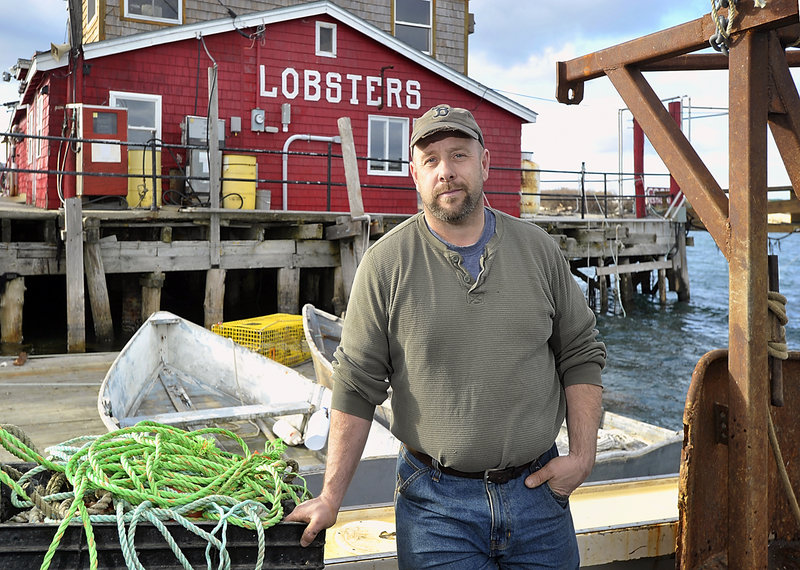 Alex Todd is pretty happy with last year's lobster catch and the earlier season for shedders as he takes a break from dragging for scallops around the waters of Bailey Island and stops at Cooks Wharf in Bailey Island.