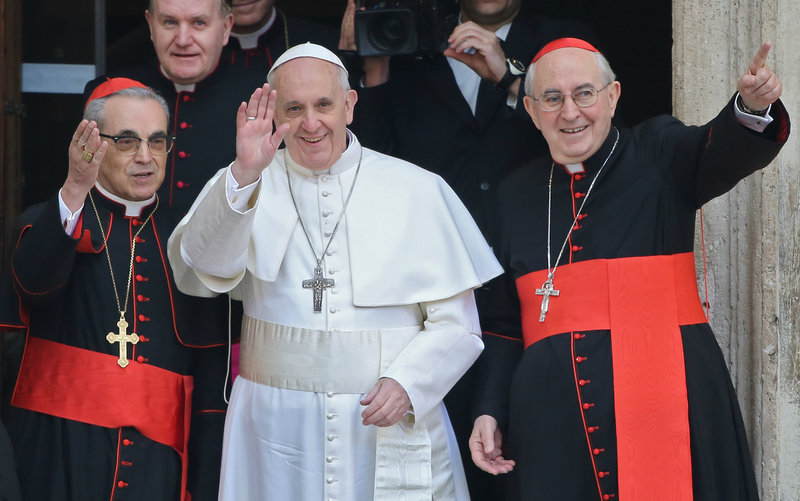 Pope Francis waves from the steps of the Santa Maria Maggiore Basilica in Rome Thursday. At left is Cardinal Santos Abril of Spain and, right, Cardinal Agostino Vallini, Vicar General of Rome.