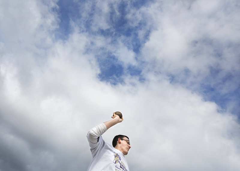 Cheverus junior Michael Sinclair prepares to throw the shot during a chilly but reasonably sunny opening practice.