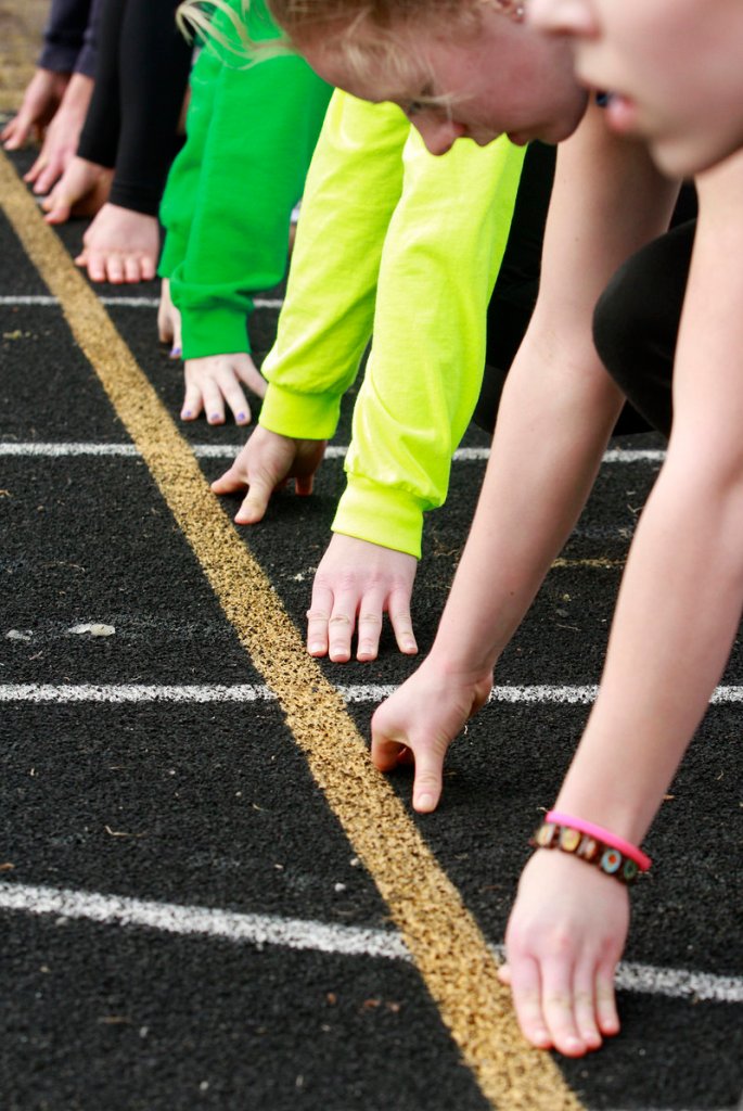 Some wore jackets and some braved the elements in short sleeves as Cheverus runners worked on their starting techniques at practice.