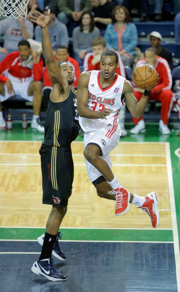 Portland’s Chris Wright looks to pass against Erie’s Keith Benson during Thursday’s victory at a sold-out Expo, won by the Red Claws, 109-102.